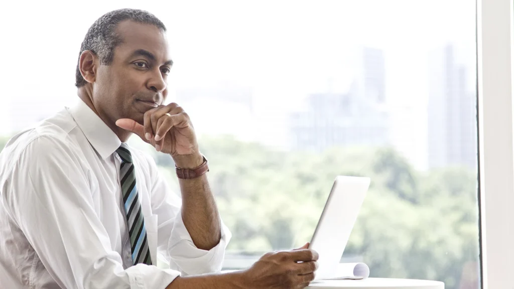 Businessman working on tablet device